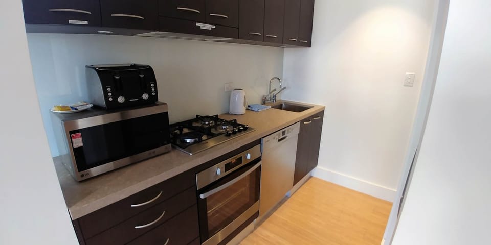 Compact kitchen but well equipped with a full size dishwasher