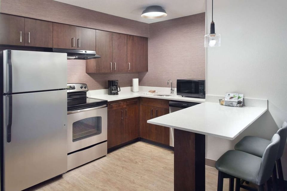 Serve meals effortlessly with full appliances and generous counter space.