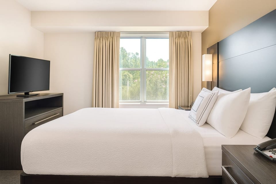 Settle into a bright, airy room with relaxing treetop views.
