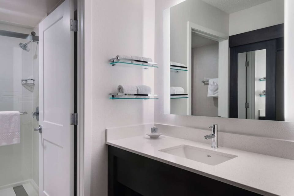 Full bathroom with a shower. Basic toiletries and towels are provided.