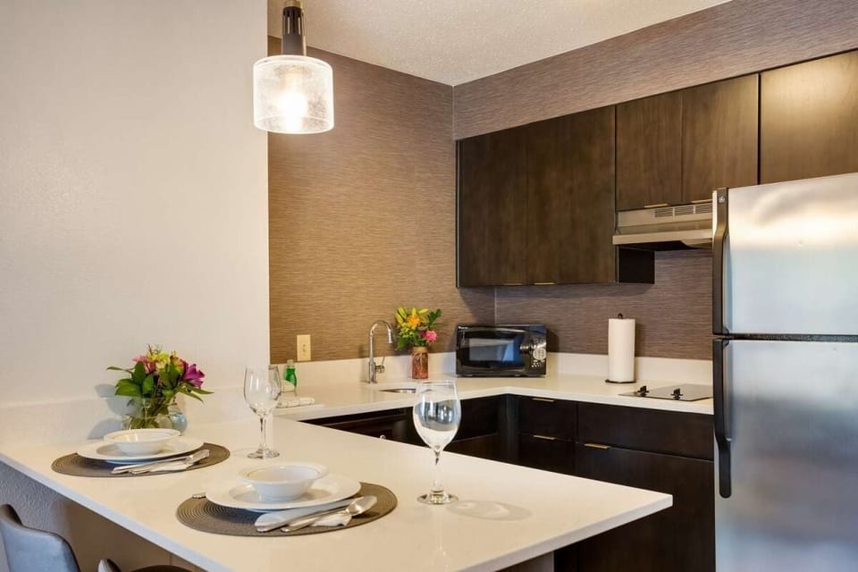Cook simple meals with sleek counters and full-size fridge.