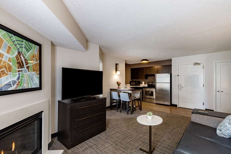 Enjoy movie nights with a big TV and easy dining setup.