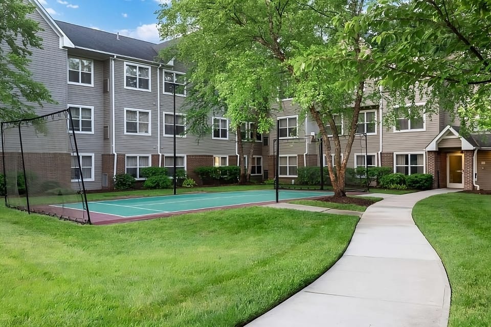 Step outside to green lawns and an on-site sport court.