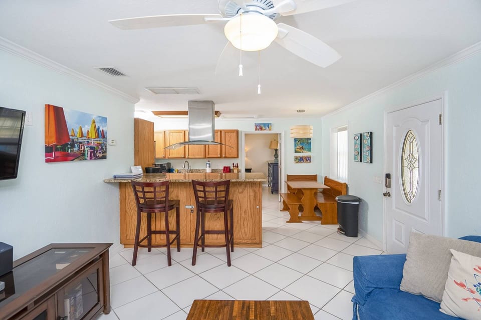 Experience the open floor plan that merges living, dining, and kitchen areas, creating a comfortable space where relaxation and connection unfold.
