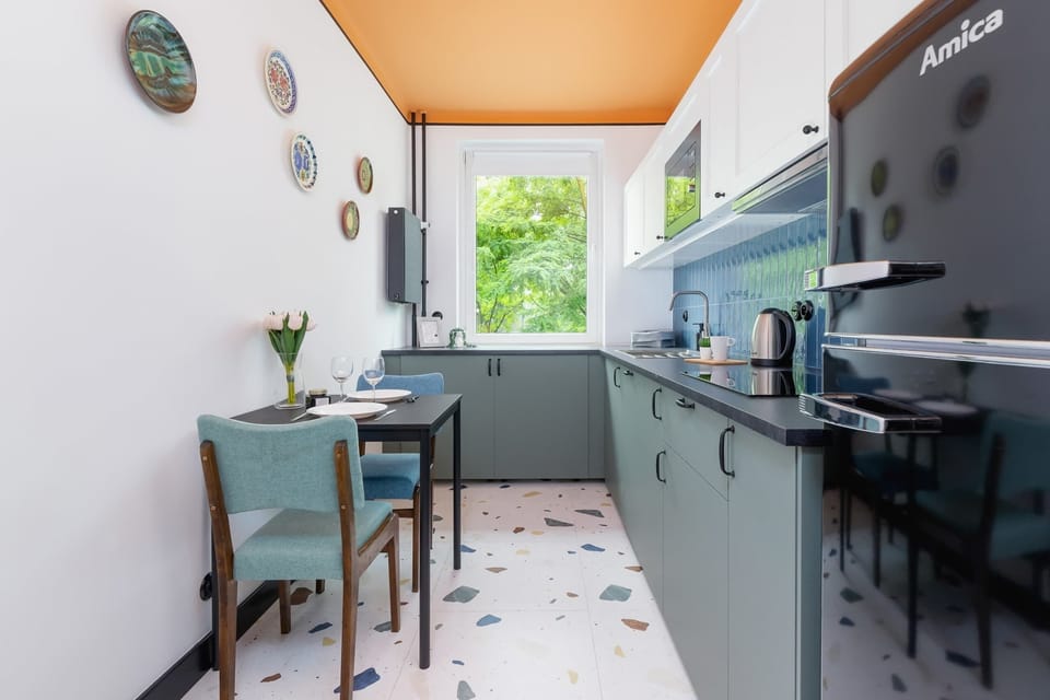 Functional kitchen with quality appliances that ensure you can prepare home-cooked meals, There is a table in the kitchen where you can have breakfast.