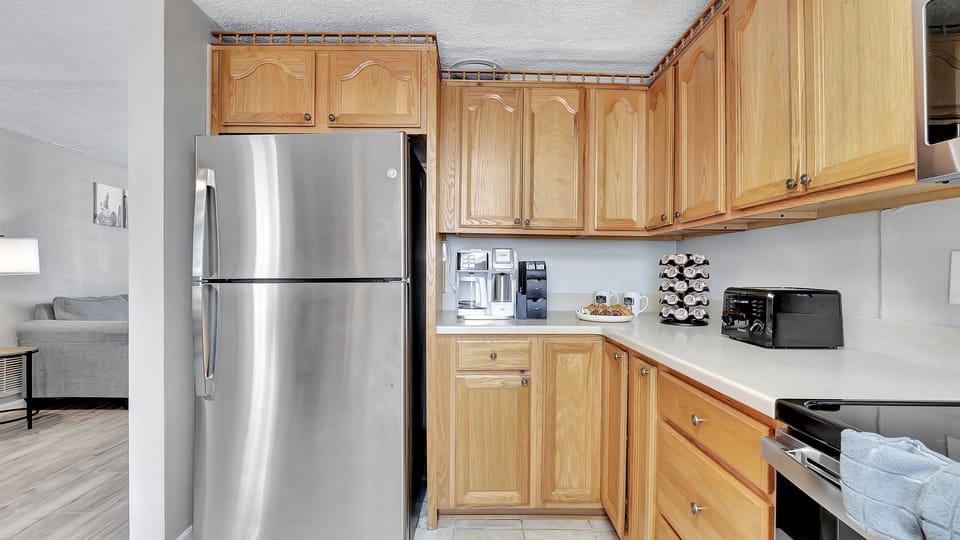 Rich wooden cupboards exude timeless warmth and sophistication.