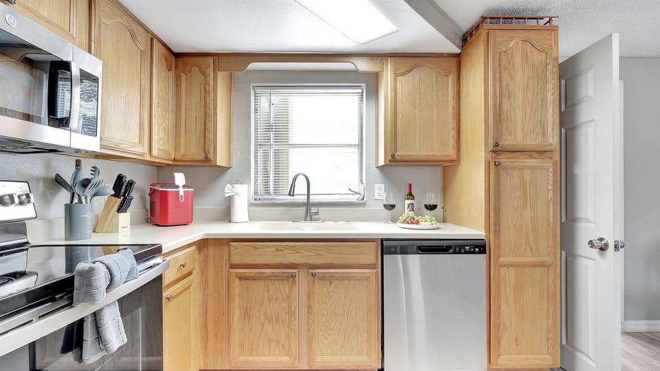 Sleek, state-of-the-art appliances stand ready to assist your culinary adventures.