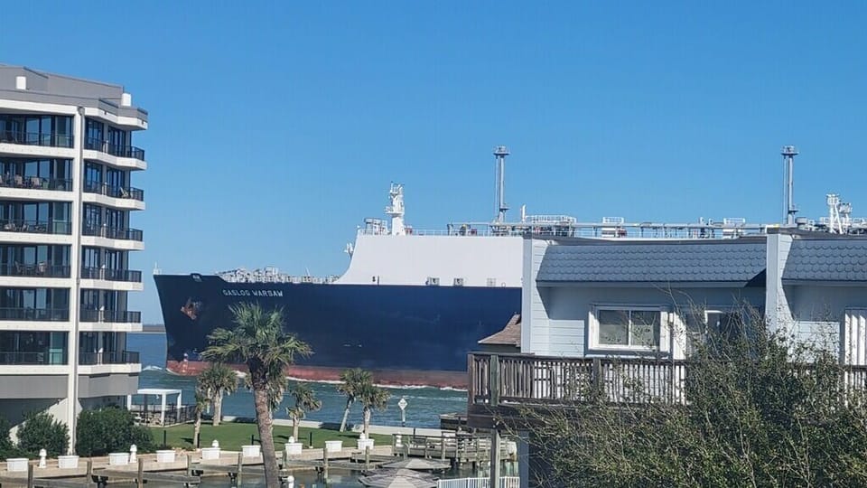 A striking waterfront location where large cargo ships pass by your accommodation, creating a unique maritime backdrop.