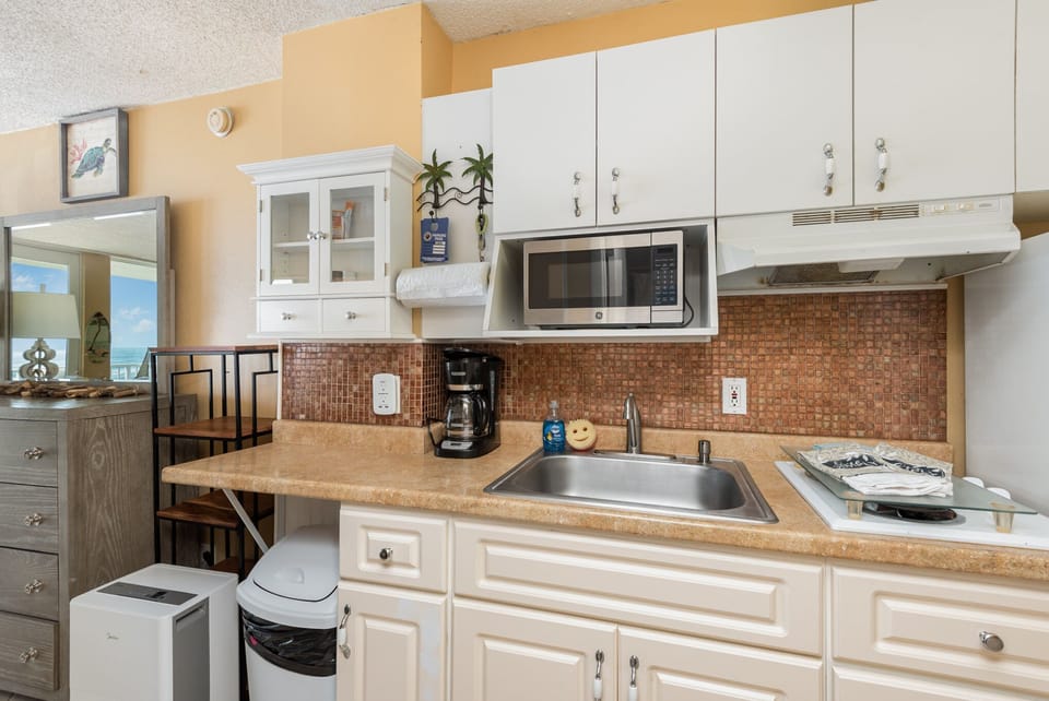 Equipped Kitchenette - 2 Burner Stove, Microwave, Full Size Fridge. All cookware