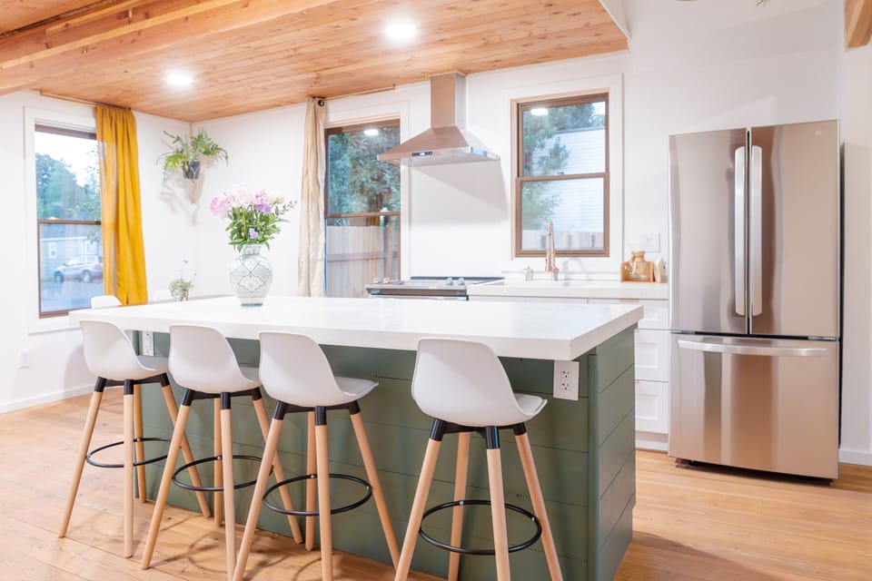 This custom concrete countertop has green gems from Oregon throughout. 
