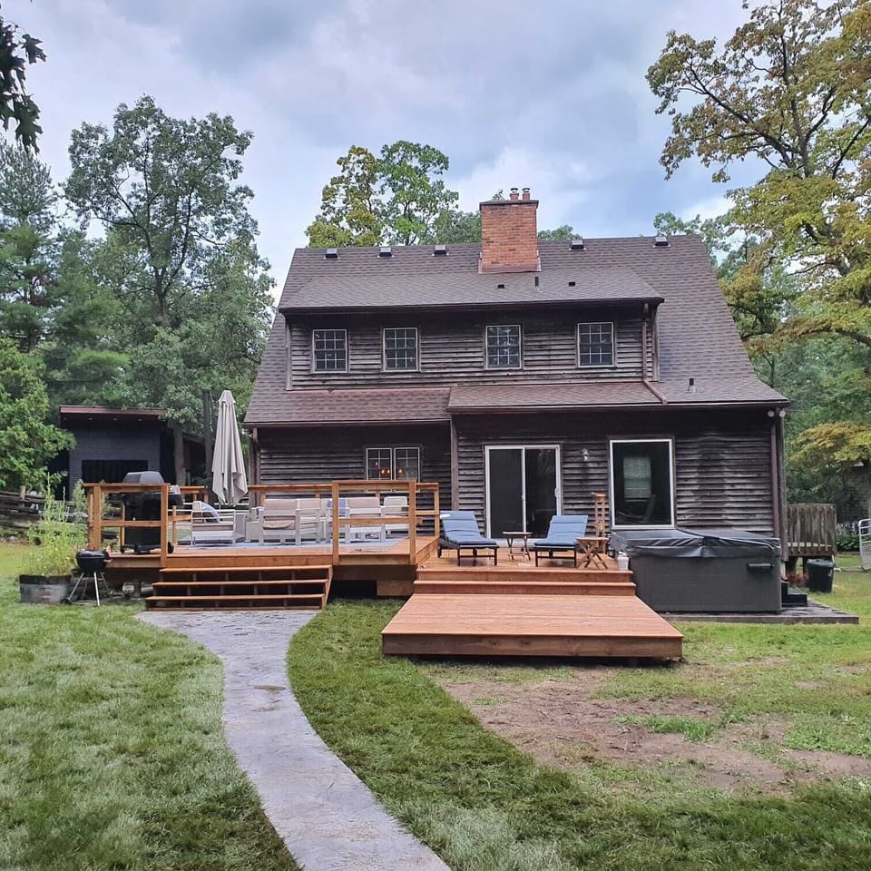 Back of Cottage - deck, sitting areas & hot tub