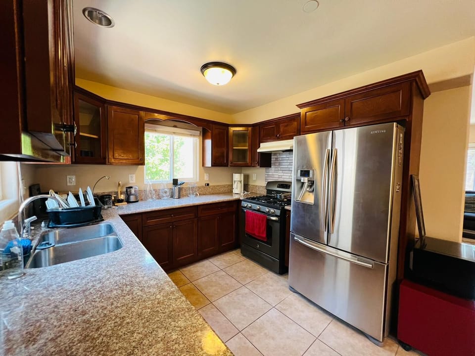 Kitchen with Refrigerator, Stove Oven, Coffee Maker etc!