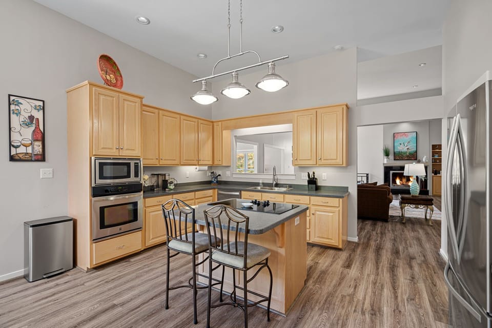 Fully stocked kitchen with island seating.