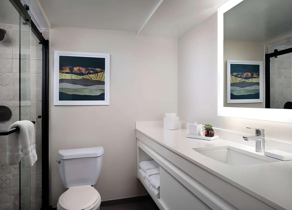 Enjoy a spotless vanity and soft lighting for easy mornings.