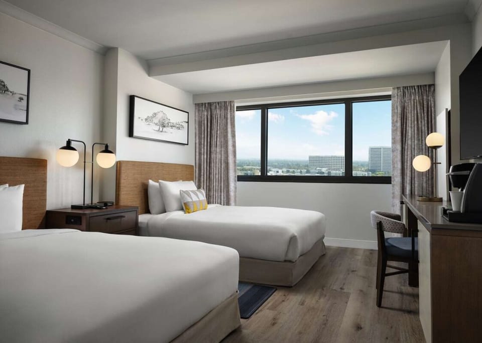 Wake up to skyline views in bright, airy comfort.