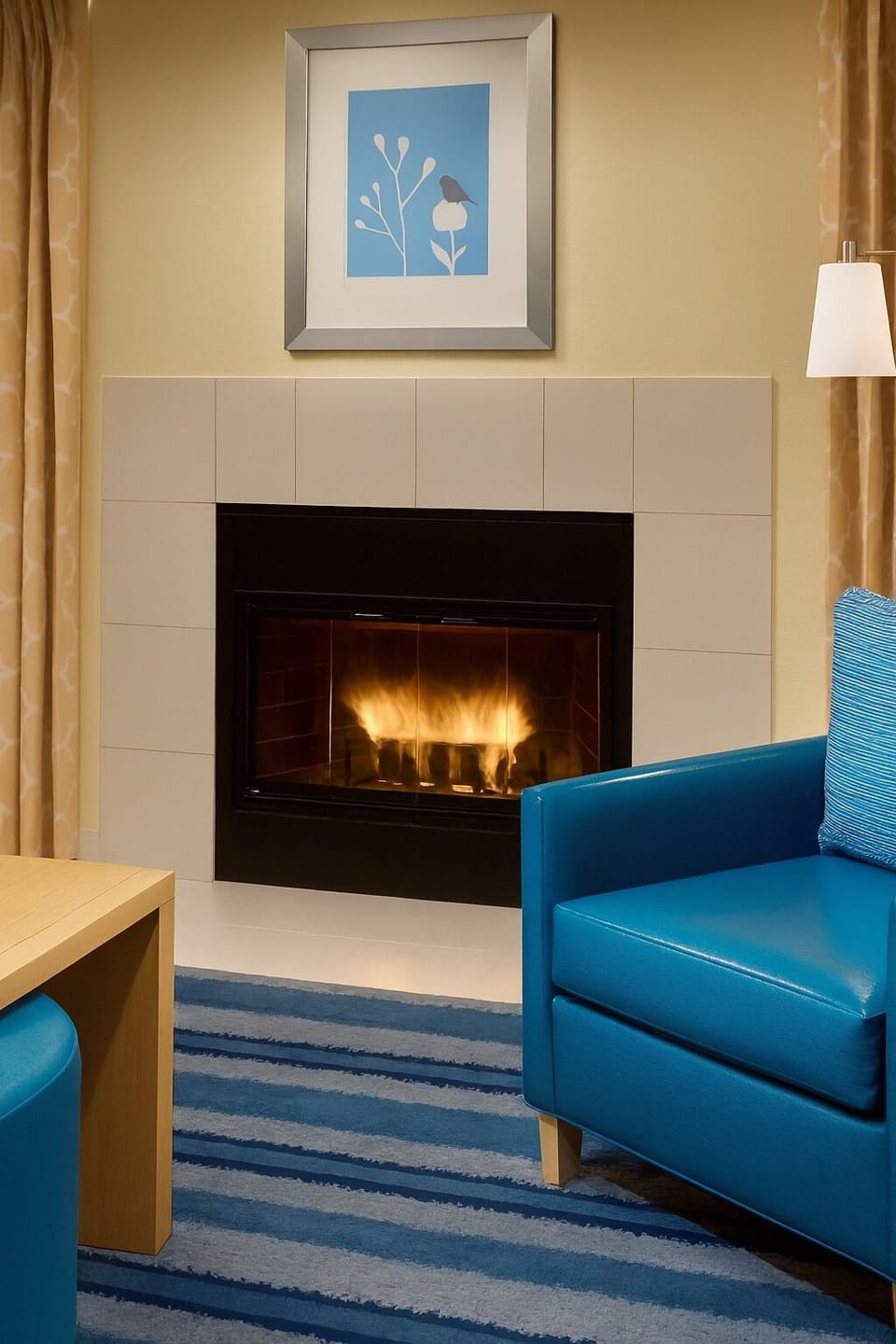 Cozy up fireside with a warm glow and quiet ambiance.