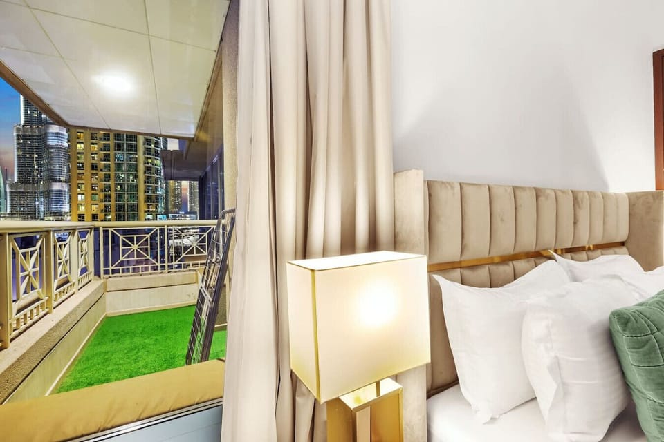 Bedroom Retreat: Unwind with stunning skyline views from your private balcony haven!