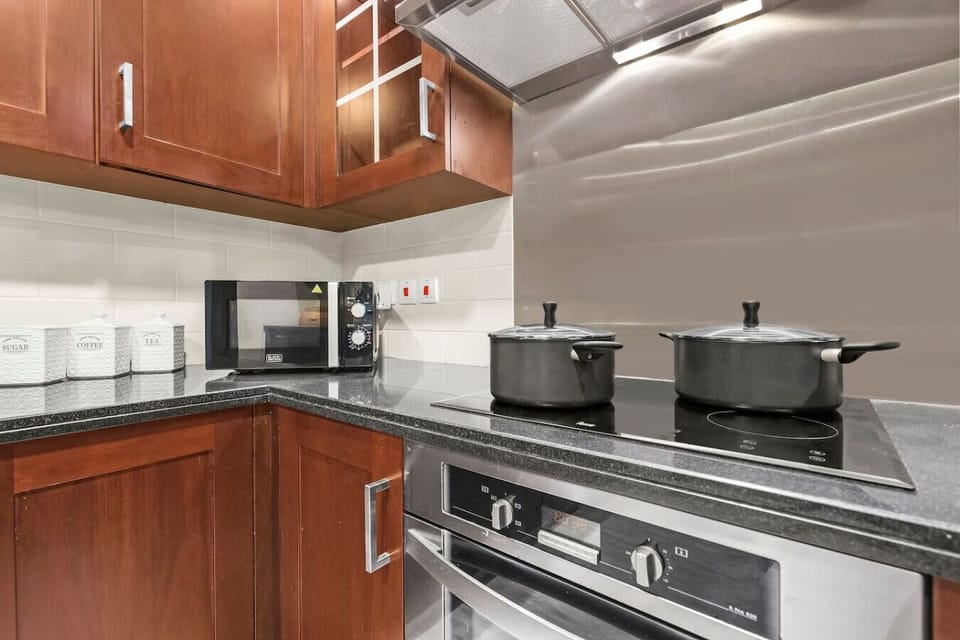 Kitchen: Cook gourmet meals in this stylish, fully-equipped kitchen with modern amenities!