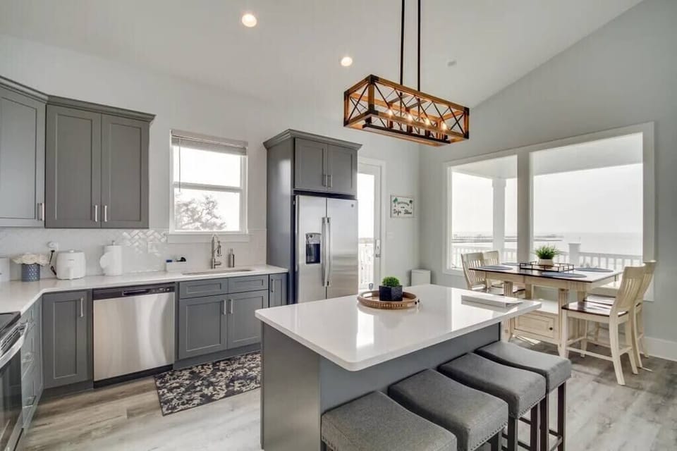 Enjoy a fully stocked kitchen and a view of the ocean from the expandable dining room table!