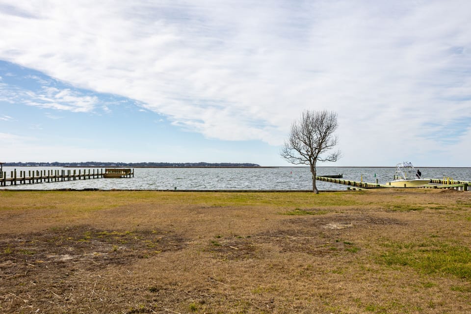Picturesque, spacious back yard extends to the Sound
