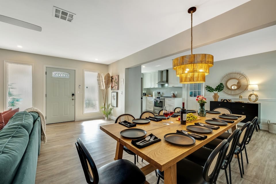 The centerpiece of the dining area, the 10-seater wooden dining table, commands attention with its craftsmanship and beauty.