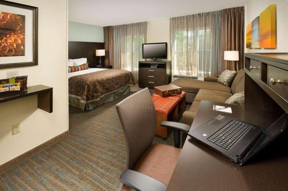 Unwind in a spacious suite with lounge and work desk.