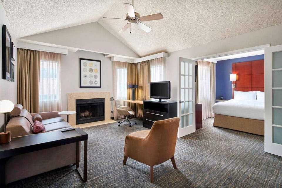 Stretch out in the airy suite with fireplace and seating.