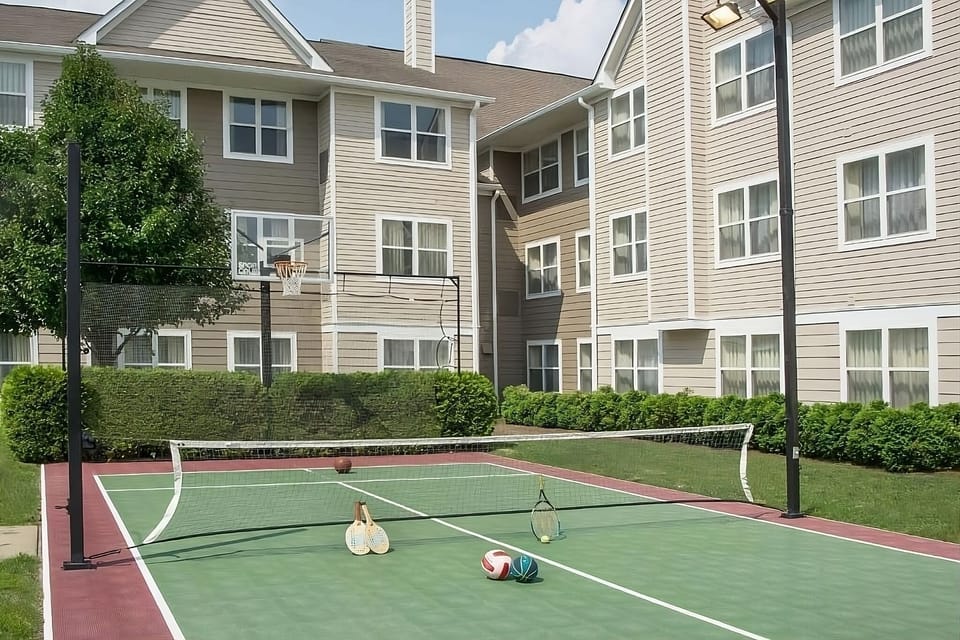 Play a sunny match on the on-site sport court.