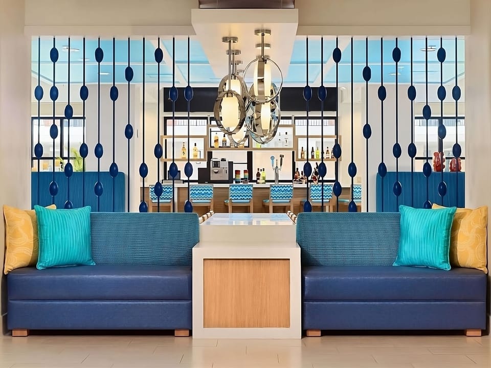 Sink into plush seating with chic lighting and cocktails nearby.