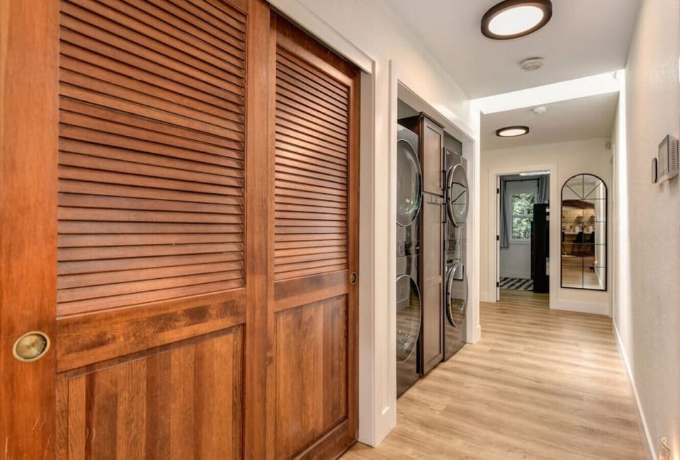 Hall way closet and double washer dryer combo.