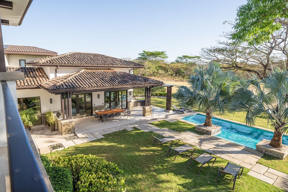 Take a refreshing dip in the private pool of this Hacienda Pinilla estate, a perfect retreat for family-friendly or group-friendly Avellanas Beach vacations.