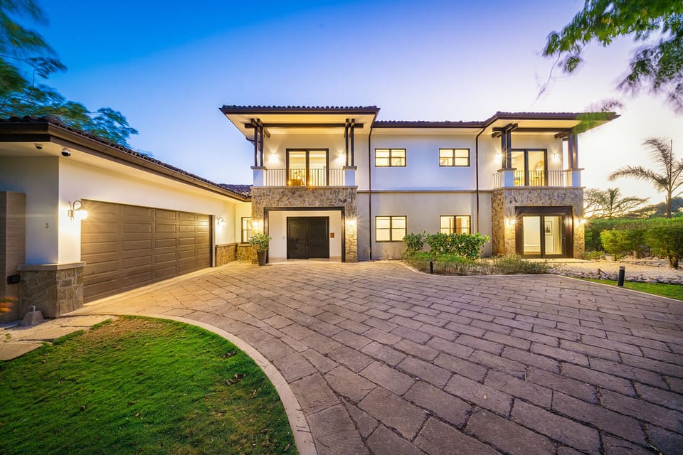 The stylish entryway of this luxury Avellanas Beach home at Hacienda Pinilla provides an open and inviting space, perfect for families or group retreats.