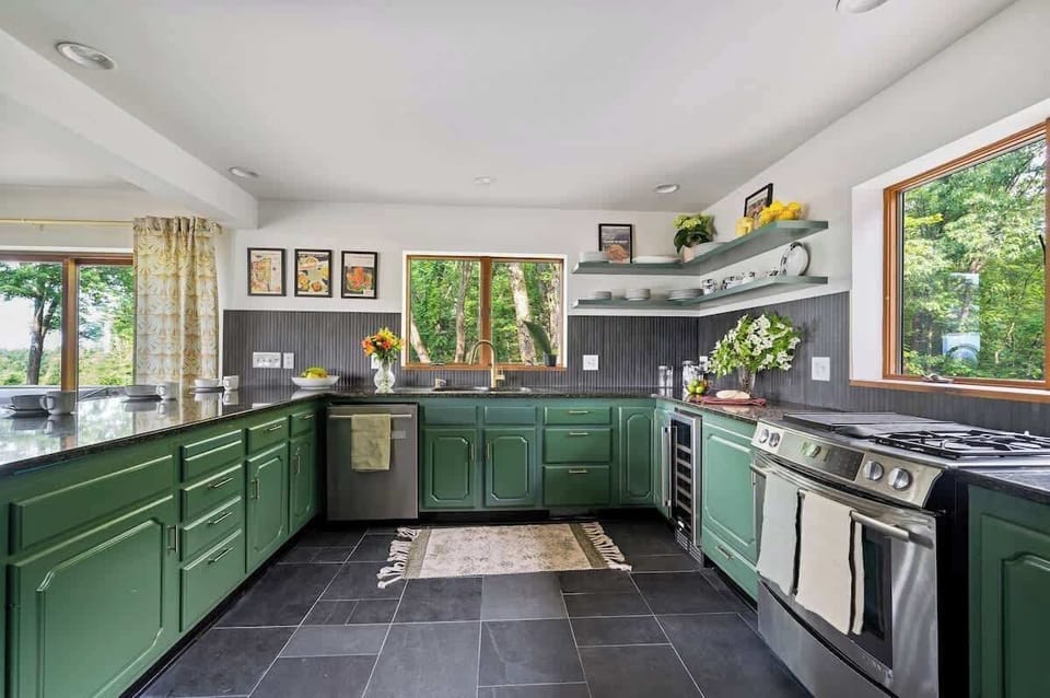 Open-concept modern kitchen w/stainless steel appliances
