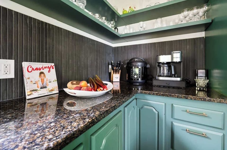 Kitchen details - coffee maker, cookbook, knife set & glassware 