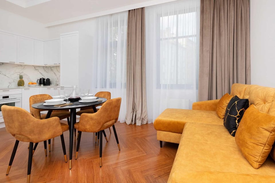 A wide view of the open-plan living and dining area, combining stylish decor with functional design.
