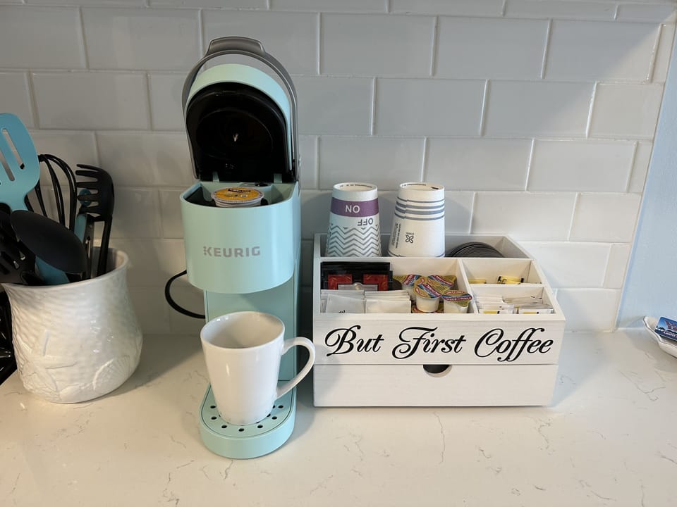 Mini coffee bar with complementary k cups, tea, sugar and creamer 