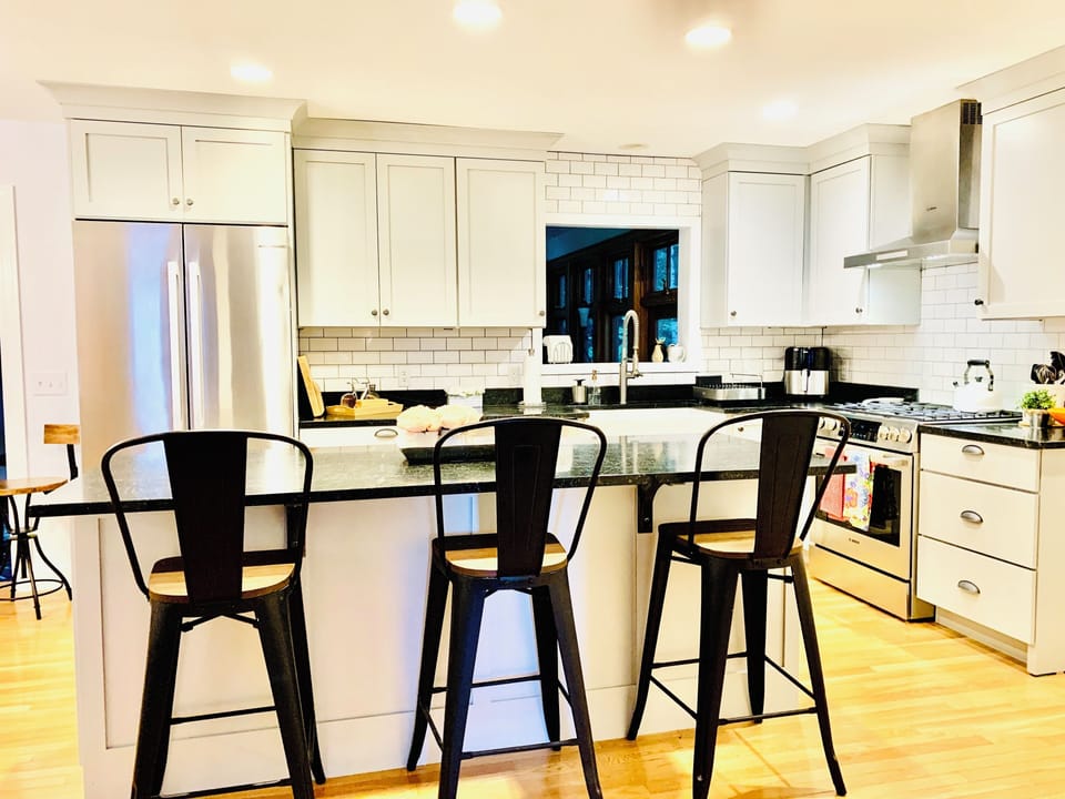 Large island w/speed oven/microwave/convection oven unit. Seats 3. 