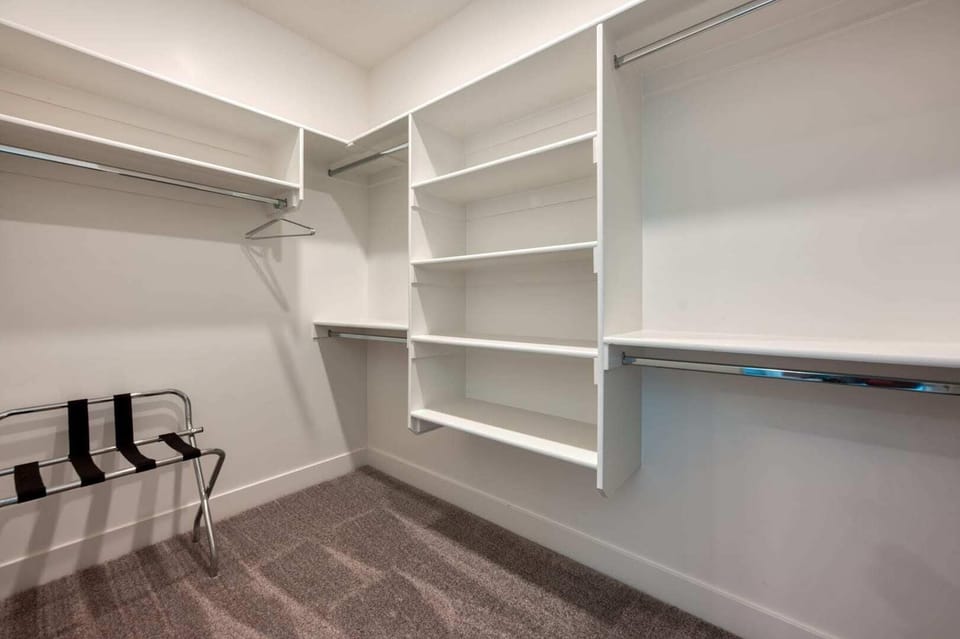Store your luggage and more. The master suite's generous walk-in closet offers ample storage for all your belongings.