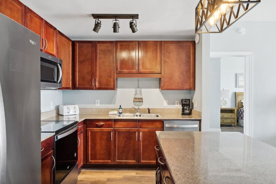 Fully Stocked Kitchen with Stainless Steel Appliances, Ocean Views and Island Bar Seating