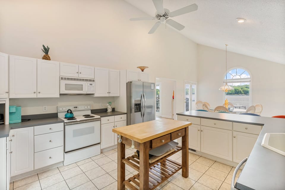 Fully Stocked Kitchen with island.