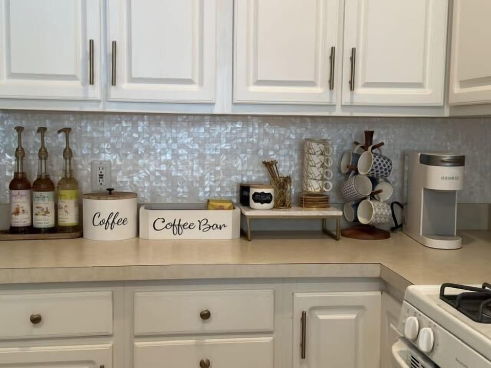 Kitchen with coffee bar, kurig, blender, toaster oven, high quality pots and pans, premium plates, bowls, silverware, wine glasses and much more