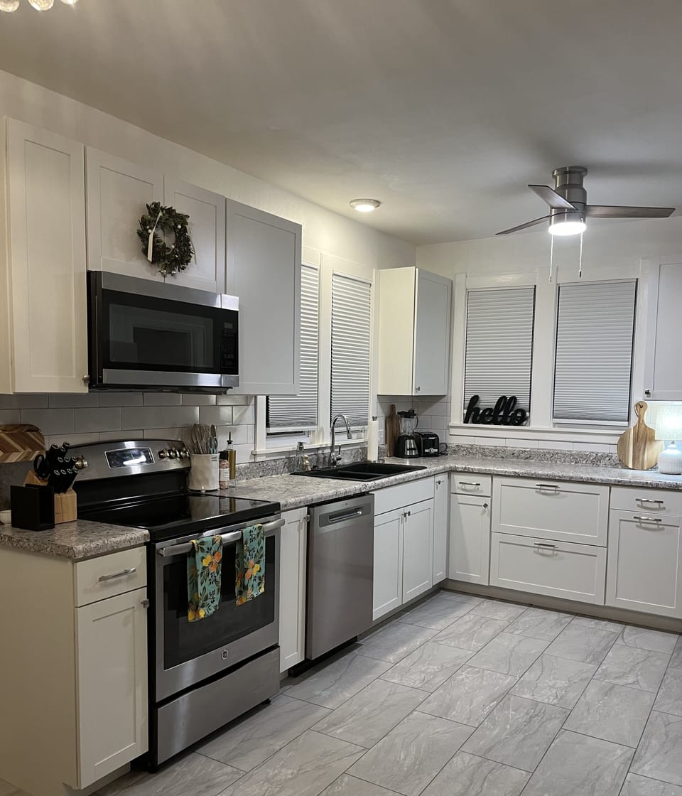 Fully stocked kitchen modern and new appliances.