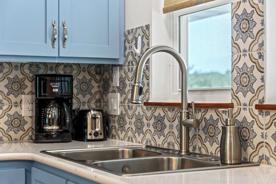 Kitchen sink has garbage disposal too. Dishwasher is there too.