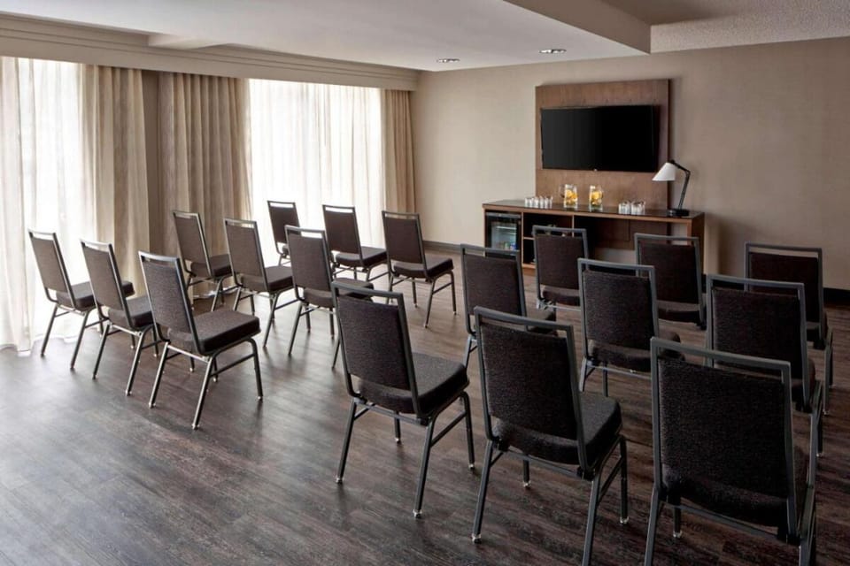 Gather the team in a bright room with modern AV.