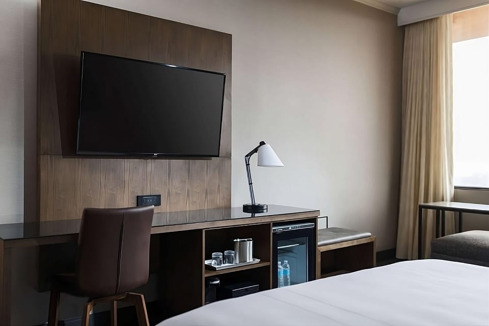 Settle in with an easy workspace, TV, and chilled drinks.