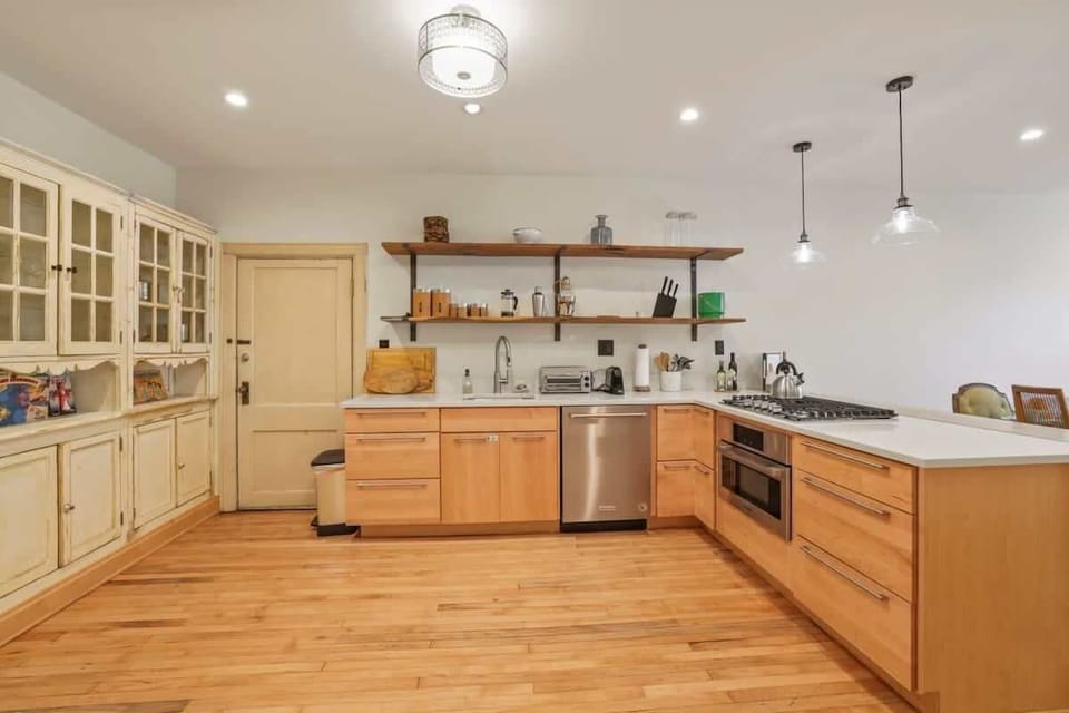 This kitchen has a stove top with NO OVEN, but does have a microwave. 