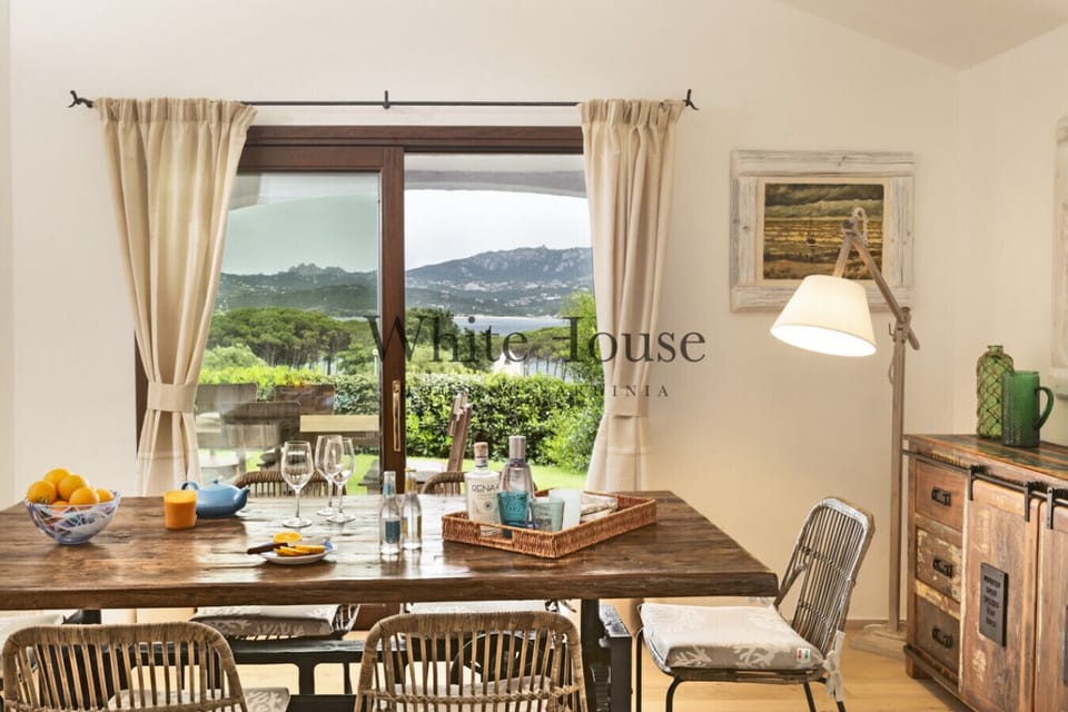 dining with a view and adjacent kitchen