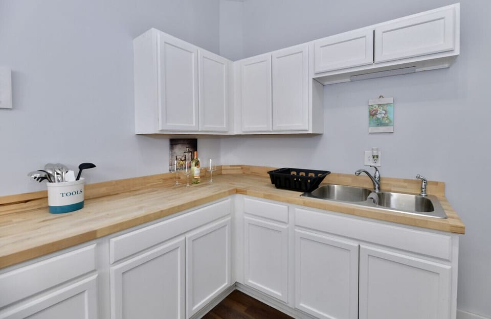 Kitchen is stocked with all your cookware, baking ware, plates and utensils