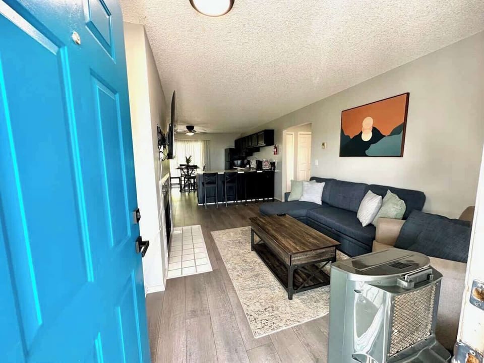 With an open floor plan leading to a sleek kitchen and dining area, this space is perfect for socializing, working remotely, or relaxing after a day of exploring. Conveniently located near top attractions, dining and entertainment.