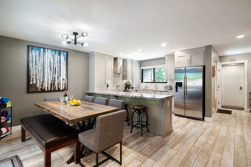 Dining Table (Seats 8) with view of Kitchen and Entry hallway